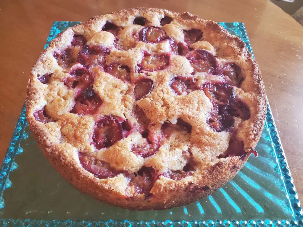 A pie sitting on top of a blue plate.