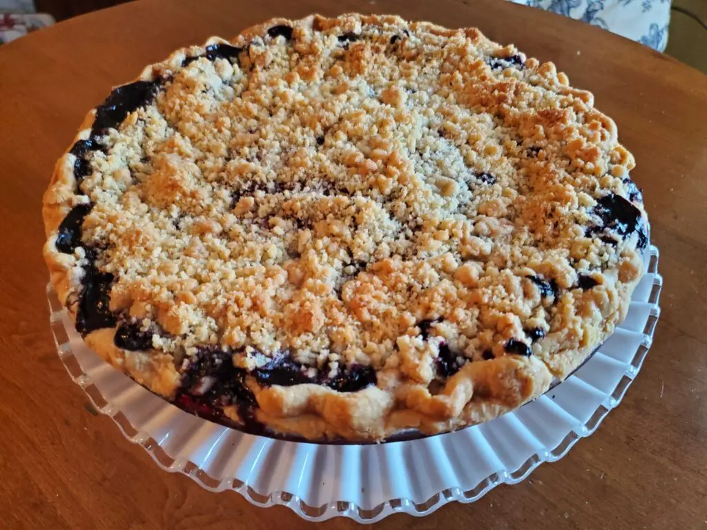 A pie with some kind of topping on it