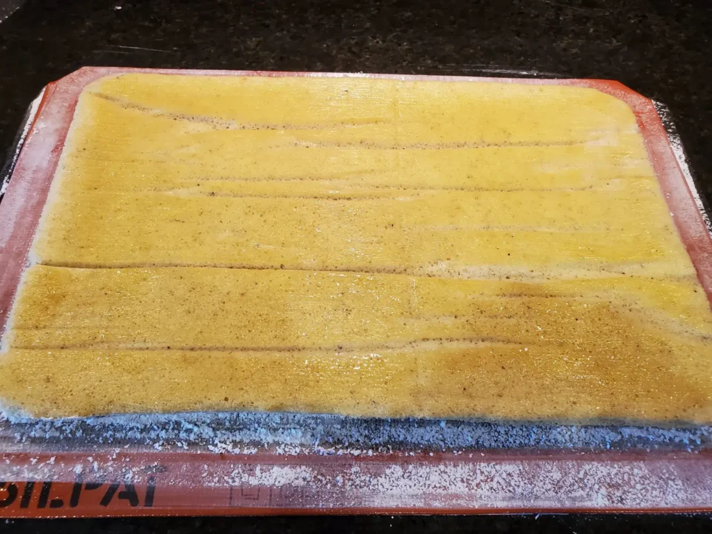 A yellow piece of paper sitting on top of a table.