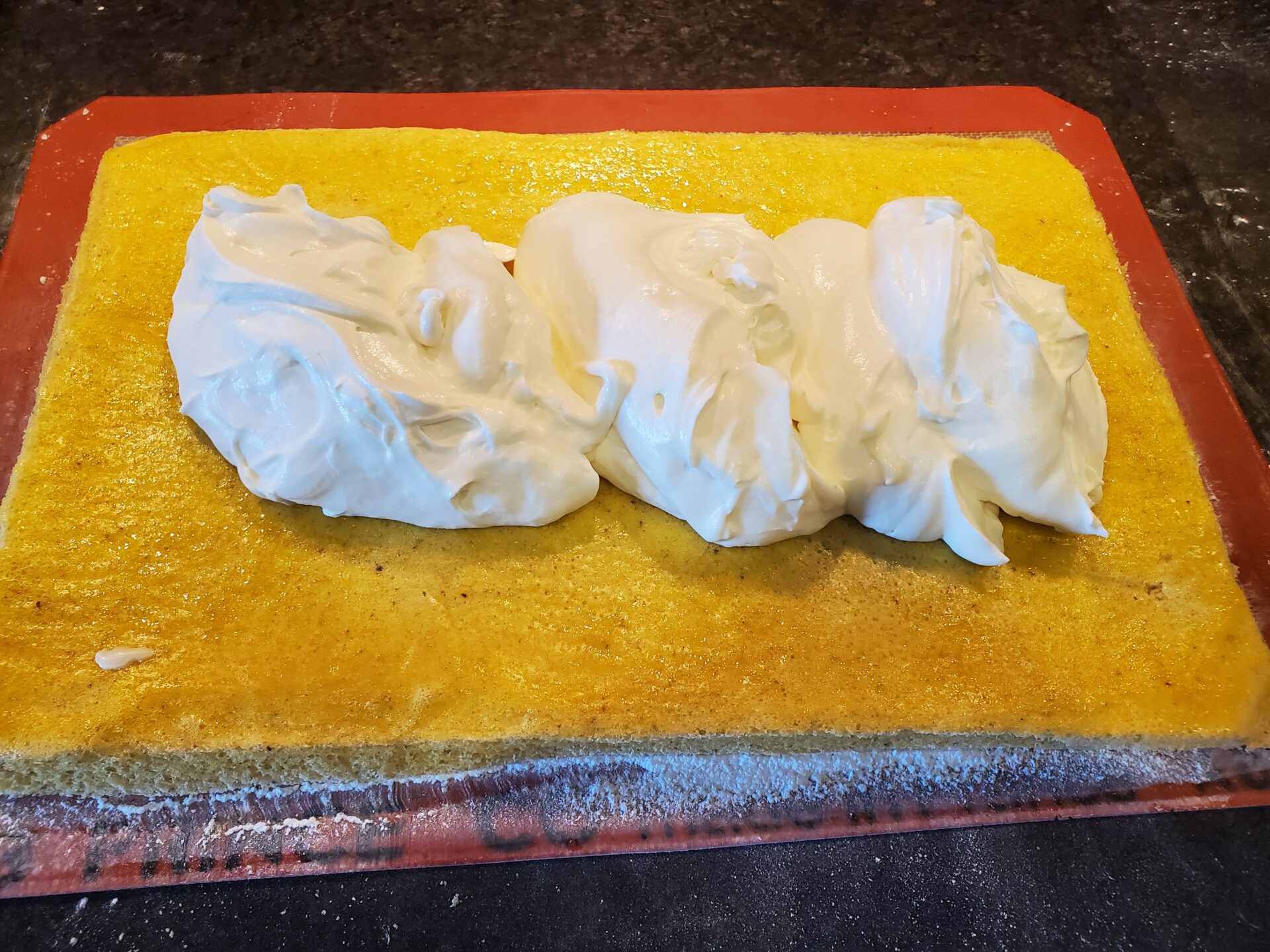 A piece of dough on top of a cutting board.