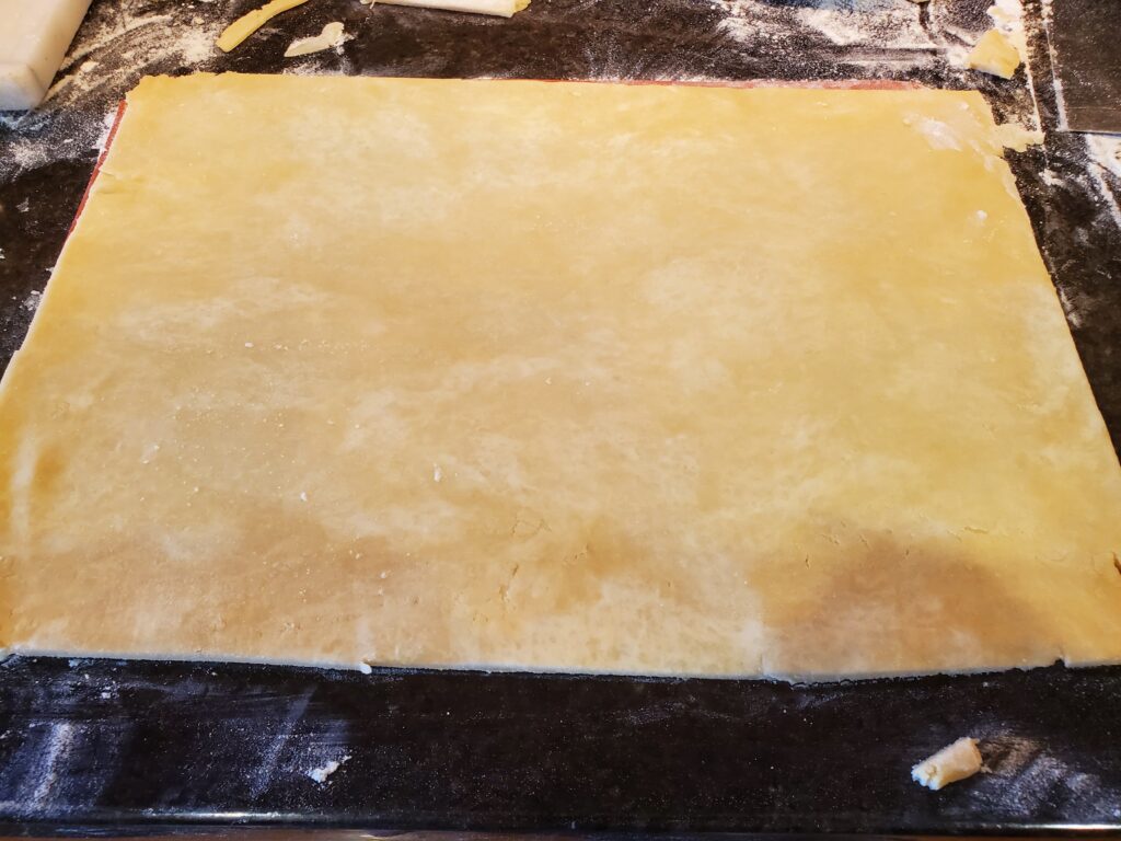 A piece of dough on top of a table.