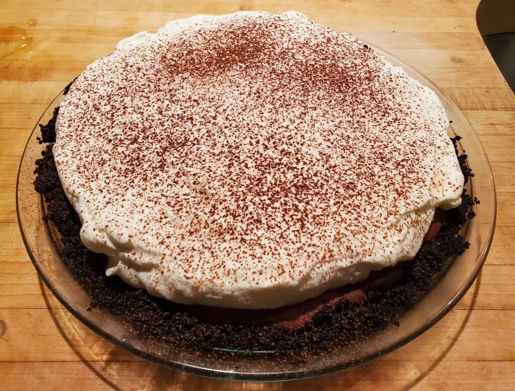 A cake sitting on top of a glass plate.