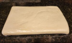 puff pastry rectangle with cling wrap