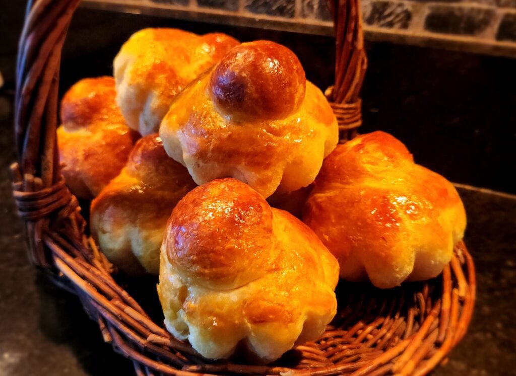 A basket full of pastries sitting on top of a counter.