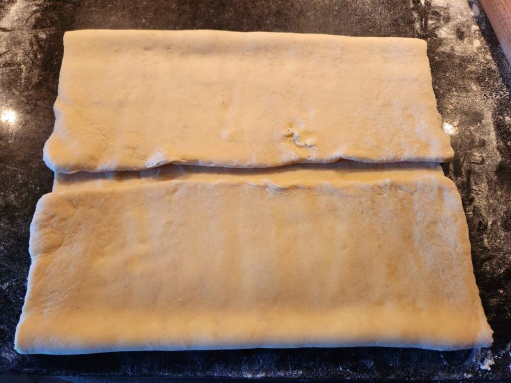 A piece of dough is sitting on the counter.