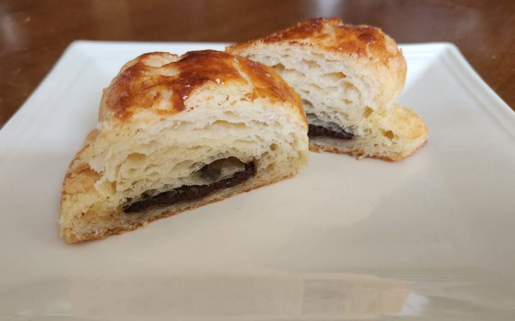 A piece of bread with chocolate spread on it.