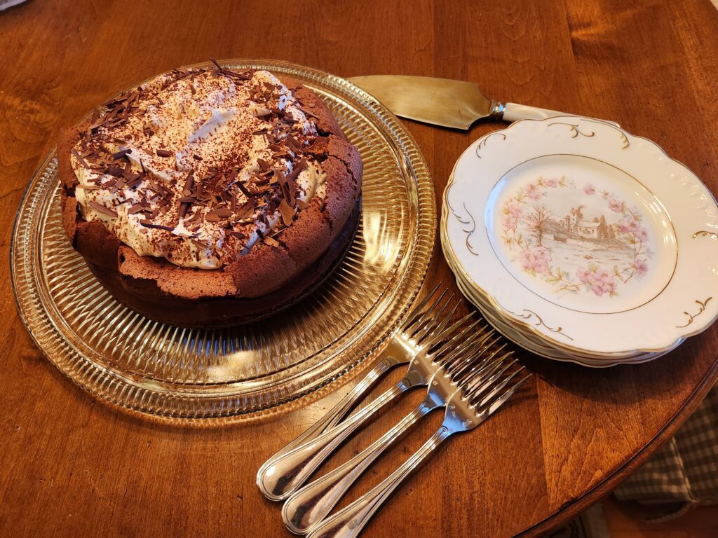 A cake sitting on top of a glass plate.