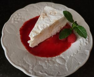 A piece of cake on top of a white plate.