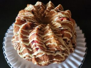 A cranberry bundt cake on a plate.