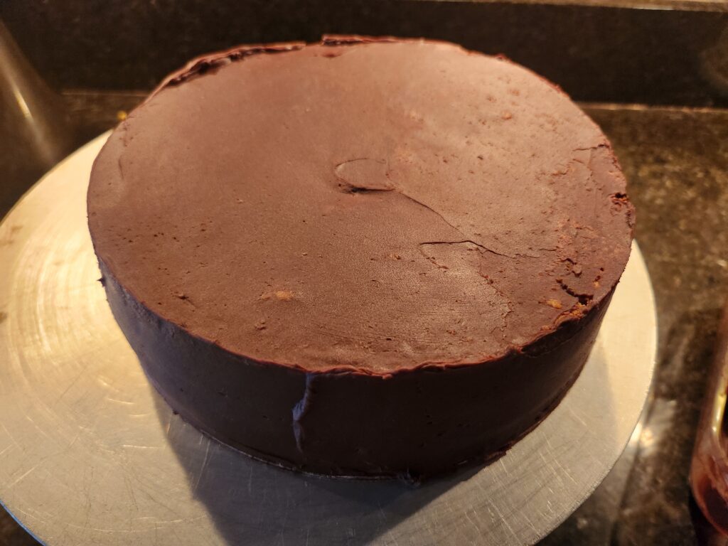 A chocolate cake sitting on top of a table.