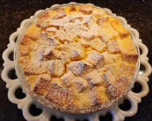 Homemade bread pudding with powdered sugar.