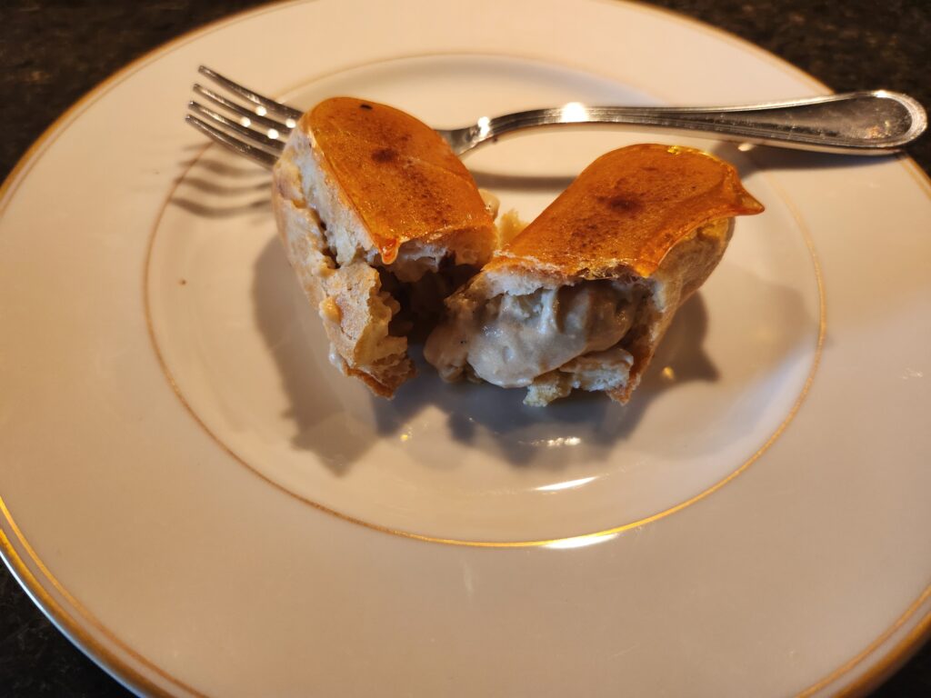 A piece of cake on top of a white plate.